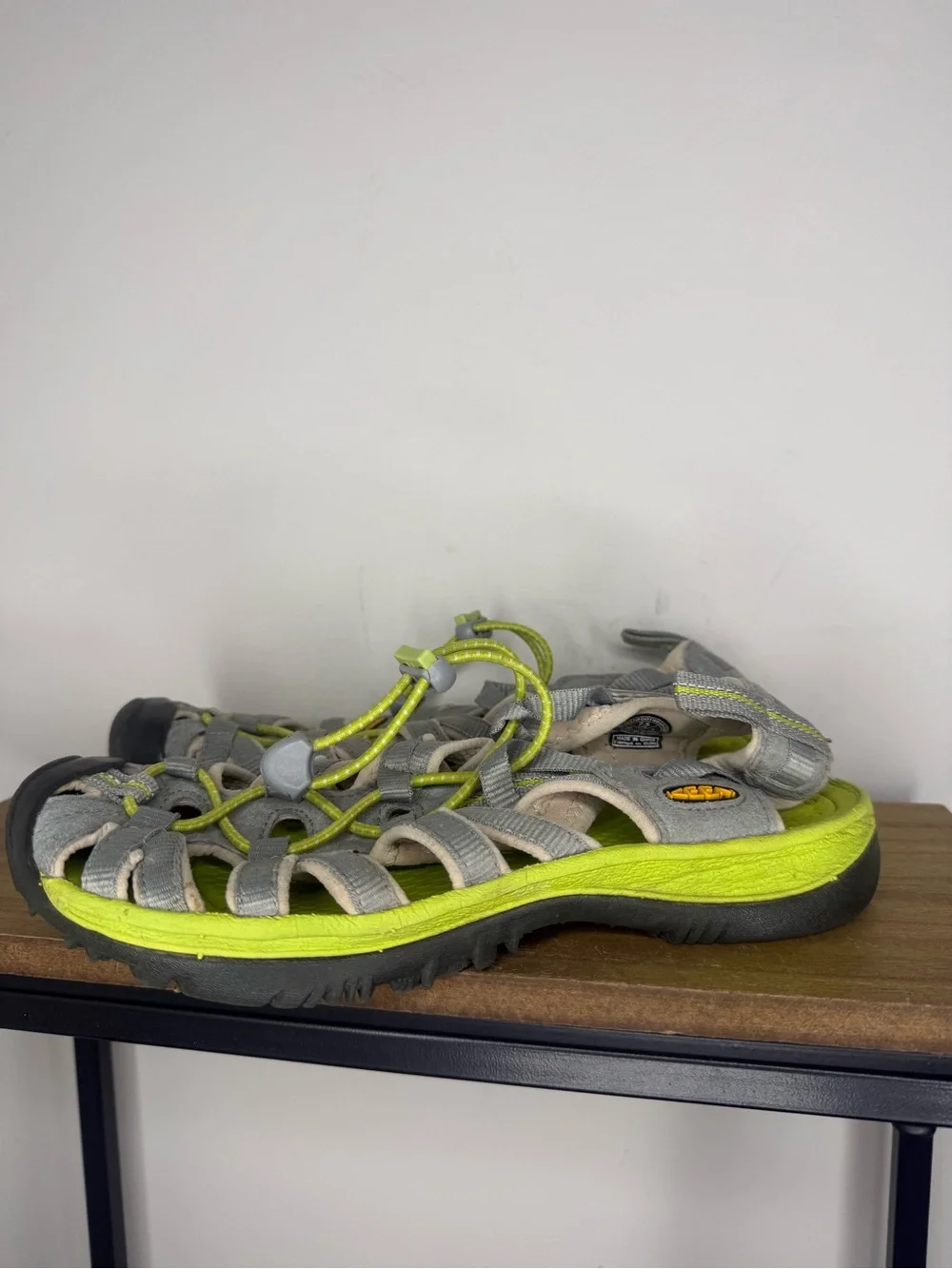 women's Keen Whisper sandals in a neutral gray and bright green colorway